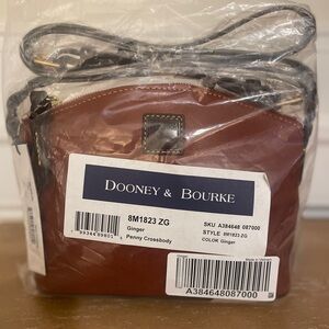 New. Never used. Dooney & Bourke leather Penny Crossbody Bag Ginger color